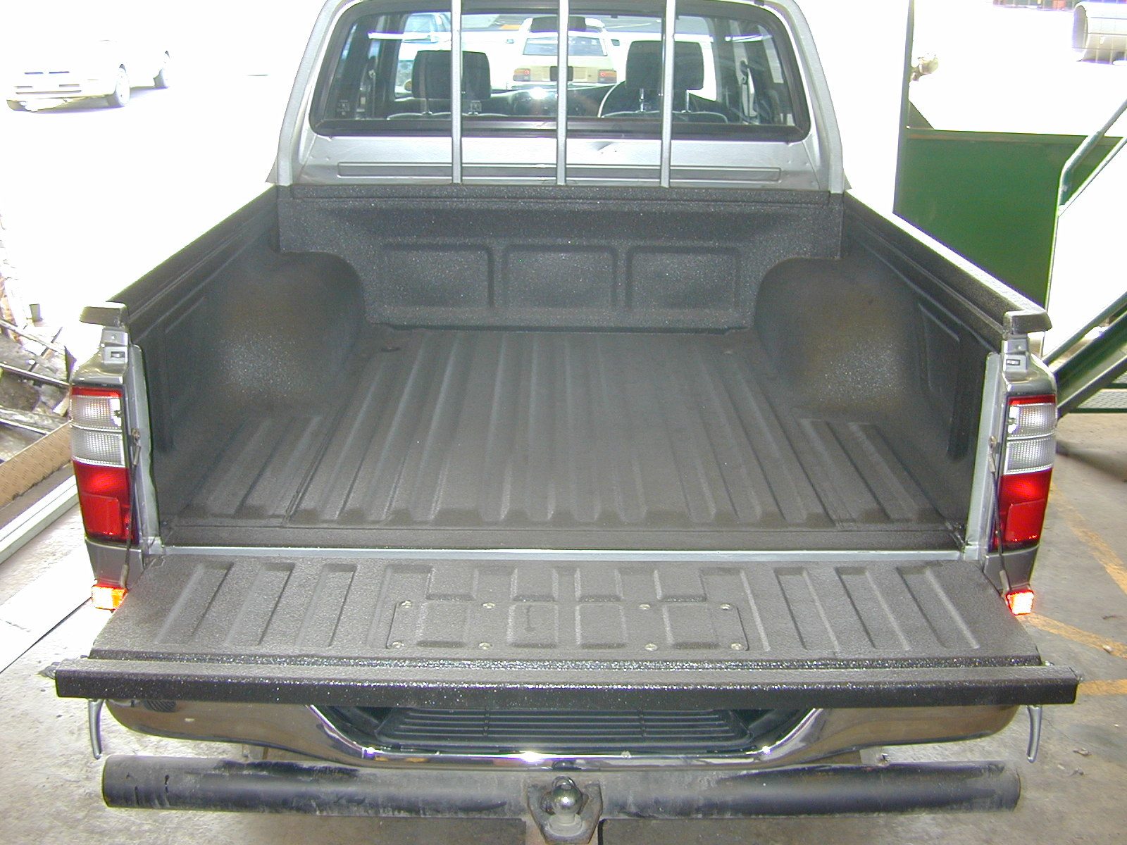 Layered protective coating system applied to metal equipment